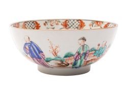 A Chinese famille rose bowl the exterior painted with figures in a fenced garden,