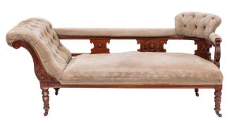 A late Victorian or Edwardian mahogany and upholstered chaise longue,