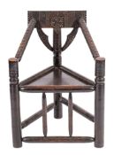 An ebonised oak turner's or 'Saxon chair', late 19th / early 20th century; by W.