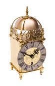 A small reproduction brass lantern clock,