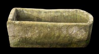 A rough hewn limestone trough,