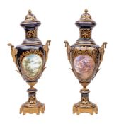 A pair of large Sèvres -style gilt-metal mounted earthenware vases and covers decorated with panels
