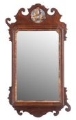A parcel gilt walnut framed wall mirror in George I style,