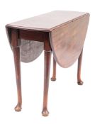 A George II mahogany drop leaf table, mid 18th century; with oval top,