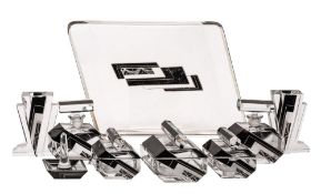 An Art Deco clear glass dressing table set, comprising a trapezoidal tray,