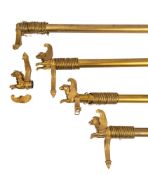 Four gilt metal curtain poles in Empire style, 20th century; comprising a pair,