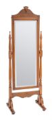 An Edwardian walnut cheval mirror,