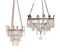 A 19th century gilt metal and glass chandelier of tiered circular form with prismatic suspensions,