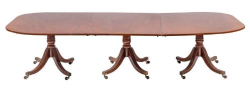 A Regency mahogany triple pillar extending dining table,