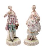 A pair of Continental figures of a gallant and lady wearing eighteenth century costume and each