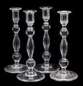A set of four cut glass candlesticks with knopped and facet cut stems, modern, 29cm.