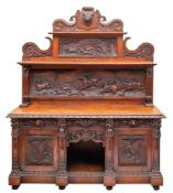 A Victorian carved oak sideboard in 17th century taste,