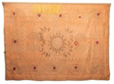 An Indo-Persian raised work wall hanging with central stellar motif enclosed by scrolls within a