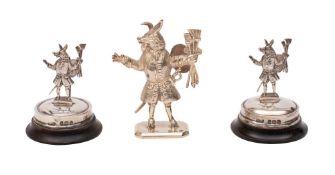 A pair of silver Trusty Servant menu holders,