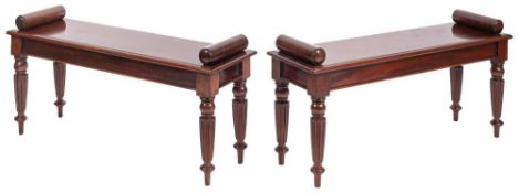 A pair of mahogany hall benches in Regency style,