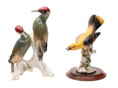 A Sitzendorf porcelain figure of a Golden Oriole and a large Karl Ens figure of two green