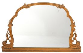 A carved and giltwood framed overmantel mirror in Victorian Rococo Revival taste,