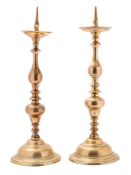 A matched pair of 17th century brass pricket candlesticks in the Dutch taste,