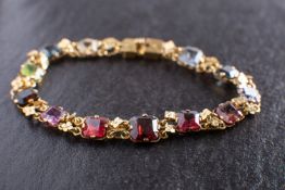 A Victorian, octagonal, step-cut vari-coloured paste and peridot bracelet,