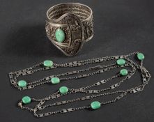 A Chinese filigree-work, buckle-shaped, hinged bangle, set with a cabochon-cut jadeite,