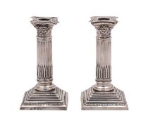 A pair of George V silver candlesticks, maker George Nathan & Ridley Hayes, Birmingham,