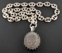 A Victorian, Etruscan revival, silver, oval locket pendant,