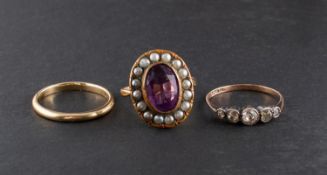 Three rings, including a white paste five stone ring,