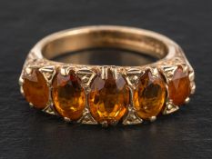 A 9ct gold, mixed-cut oval citrine five-stone ring, total estimated citrine weight ca. 2.