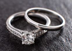 A platinum, round, brilliant-cut diamond ring and platinum band ring,