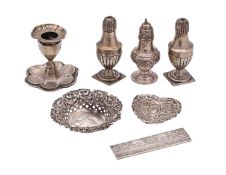 A mixed collection of silverwares, various makers and dates includes;- condiments, desk candlestick,