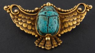A late 19th/ early 20th century, turquoise faience scarab brooch, the scarab set in a winged mount,