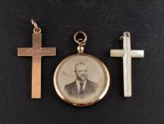 Three pendants, including a 9ct gold cruciform pendant, engraved 'Mother',