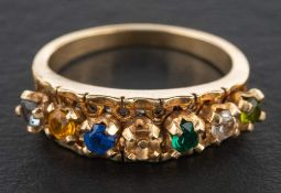 A ring set with vari-coloured, paste stones, length of ring head ca. 2.