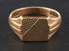 A 9ct gold square signet ring, with reeded shoulders, with hallmarks for London, 1974,