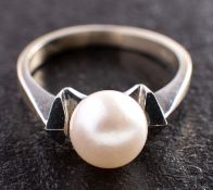 A cultured pearl dress ring, the cultured pearl of white hue with pinkish overtones, diameter ca. 7.