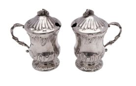 A pair of Continental silver lidded mustard pots, bears import marks for London,
