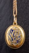 An oval, locket pendant, with blue enamel monogram 'TS',