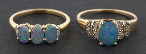 Two 9ct gold, opal triplet rings, including a three stone ring,