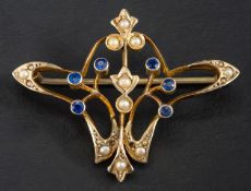 An Art Nouveau sapphire and seed pearl brooch, of whiplash design, stamped '9CT', length ca.
