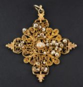 A filigreework pendant, of cruciform design, set with seed pearls, length (exl jump ring) ca. 6.