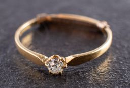 An old-cut diamond single-stone ring and round, brilliant-cut diamond ear studs,