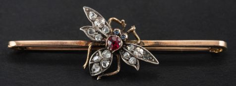 A ruby, sapphire, single and rose-cut diamond fly bar brooch, total estimated diamond weight ca. 0.