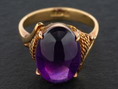 A cabochon-cut amethyst ring, estimated amethyst weight ca.