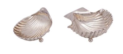 WITHDRAWN Two Mexican silver shell-shaped dishes, 925 stamped marks each raised on ball feet,
