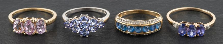 Four gemset rings, including a 9ct gold, three-stone kunzite ring,