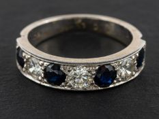 A sapphire and round, brilliant-cut diamond half-eternity ring, total estimated diamond weight ca.