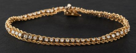 A round, brilliant-cut diamond bracelet, with ropework borders, total estimated diamond weight ca.