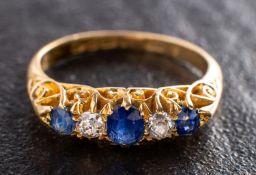 An 18ct gold, Edwardian, sapphire and old-cut diamond, five-stone ring, total diamond weight ca. 0.