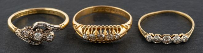 Three diamond rings, including an 18ct gold, single-cut diamond, five- stone ring,