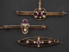 Three openwork, gemset, seed pearl brooches, including an amethyst brooch,